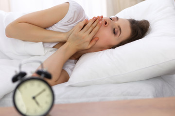 Beautiful young woman sleeping while lying in her bed. Concept of pleasant and rest reinstatement for active life