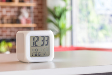 LED alarm clock standing on table background. Digital timer display. Copyspace for your design.