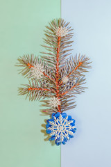 Background for cards for the New year with blue spruce branches and ornaments. Christmas card.  Top view. Copy space. 
