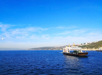 Natural and tourism concept. Many travel boats are sailing in the deep blue sea and the clear blue sky. Selective focus, background and copy space.