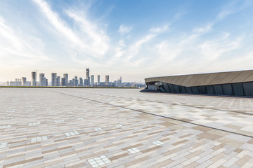 Fototapeta premium Panoramic skyline and modern business office buildings with empty road,empty concrete square floor