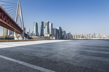 Fototapeta premium Panoramic skyline and modern business office buildings with empty road,empty concrete square floor