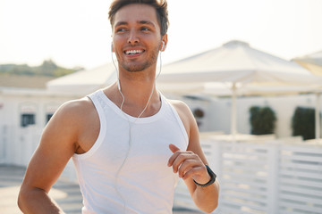 Athletic runner man with seductive, perfect smile