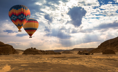 Naklejka na ściany i meble Hot Air Balloon travel over desert