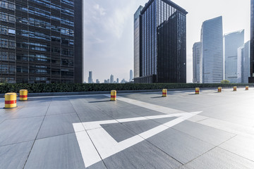 Panoramic skyline and modern business office buildings with empty road,empty concrete square floor