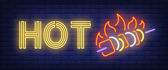 Hot neon sign. Kebab and fire flame on brick wall background. Vector illustration in neon style for barbecue restaurant, picnic, bar