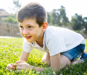 boy sitting grass