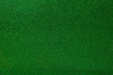 Abstract green glitter texture background. Glowing shiny paper for warp your gift box or party...
