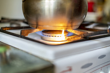close up gas lighter turn on gas stove at home to cook food f