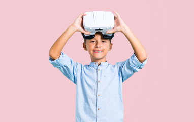 Little kid using VR glasses on color baackground
