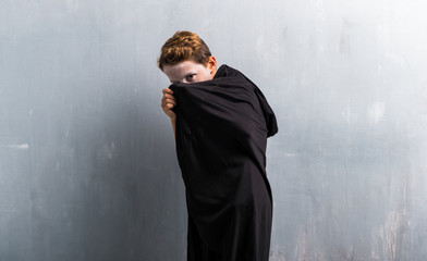 Boy in vampire costume for halloween holidays