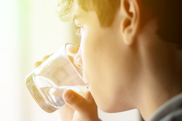close up teenager drinking pure water from glass  f