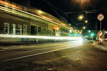 Fototapeta na wymiar Time Exposure Train lights laser It information night Mannheim