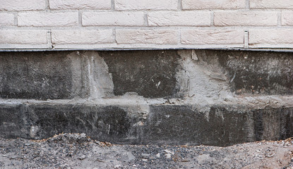 White brick wall with basement under construction