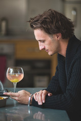 Portrait of a young attractive man taking a selfie with his mobile phone
