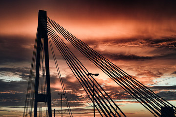 Obraz premium Mannheim Ludwigshafen Germany Bridge red dramatic sky siluette black