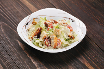 Caesar salad on a white plate