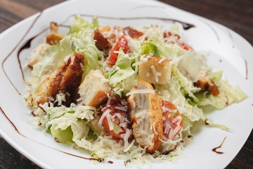 Caesar salad on a white plate