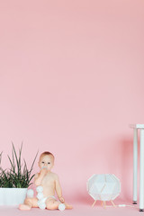 Nursery for children. Kids. Family morning at home. New born kid. Diaper. Child. Childhood. Kindergarten. Toys. Baby boy wearing diaper. Little boy