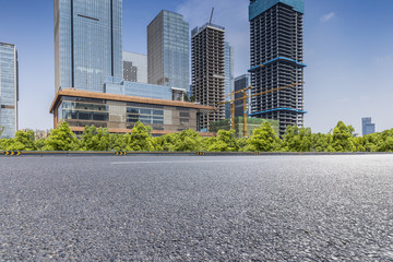 Panoramic skyline and modern business office buildings with empty road,empty concrete square floor