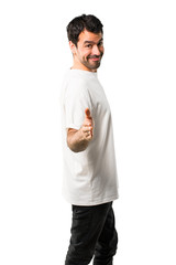 Young man with white shirt handshaking after good deal on isolated white background