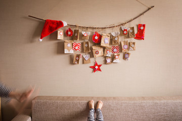 the advent calendar hanging on the wall. small gifts surprises for children