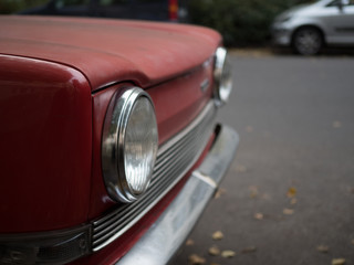 Obraz na płótnie Canvas Frontlights of a red car