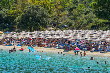 Fototapeta premium Olympiada, Greece - August 18, 2018: Proti Ammoudia beach, one of the most beautiful beaches in the Aegean Sea.