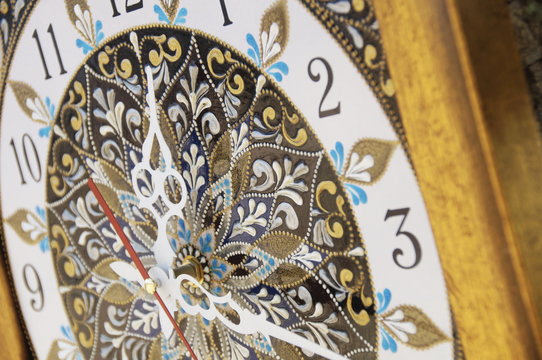 brown square hand-painted watch with contour acrylic paints in the technique point to point, with a geometric pattern in the form of a mandala, black numerals and white arrows