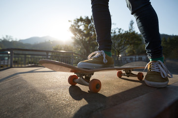 Skateboarder skateboarding at skatepark
