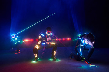 Laser show performance, dancers in led suits with LED lamp, very beautiful night club performance,...