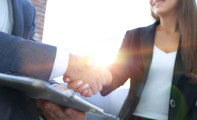 Close-up of two business people shaking hands