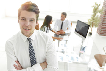 successful businessman on background of office.