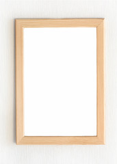 Fototapeta premium Blank light wooden vertical frame for picture hanging on white wall. Mock up design. Copy space. Realistic vector illustration