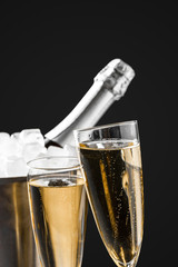 glasses of champagne with a champagne bottle in a bucket