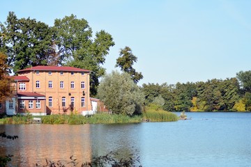 Fototapeta na wymiar Lake near the park in a medieval city