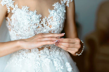 Midsection of bride trying wedding ring. bride and wedding concept
