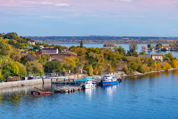 Pier with small ships in a small coastal town