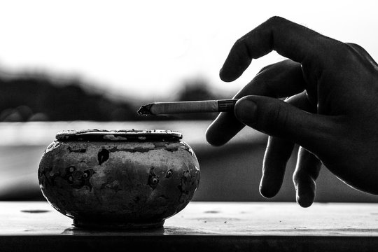 Silhouette of smokers hand