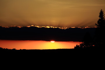 Sunsetting peeps under clouds.