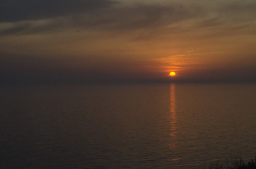 Beautiful sunset over the sea. Bright sunset sky with clouds. Black sea, Anapa, Krasnodar region, Russia