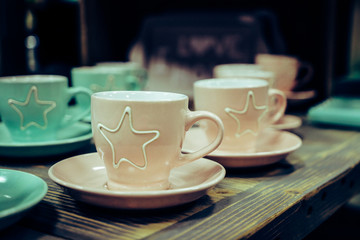 colored empty coffee cups on a table