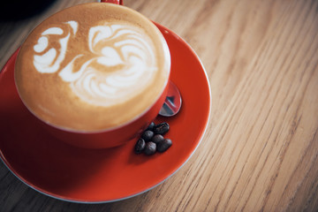 Cup of coffee latte on wood bar