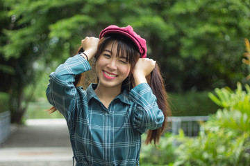 Portrait charming beautiful Asia woman at garden park nuture background.