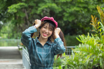 Portrait charming beautiful Asia woman at garden park nuture background.