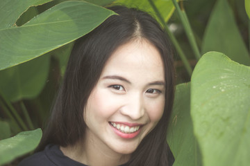 Portrait charming beautiful Asia woman at garden park nuture background.