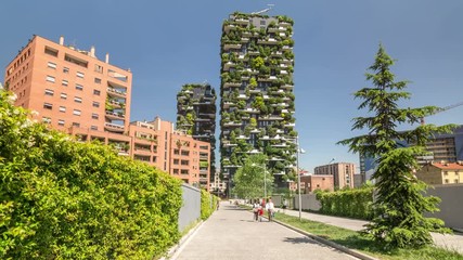 Modern ecological building, vertical gardens, terraces with trees and plants. Tilt up shot. - Powered by Adobe