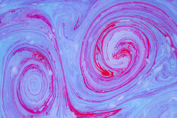 Abstract colored marble background. Stains of paint on the water.