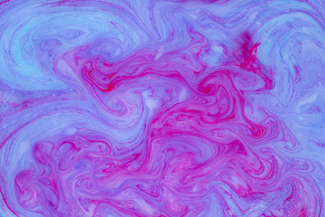 Abstract colored marble background. Stains of paint on the water.