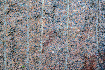 Closeup of red spotted granite texture.